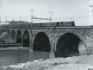 Pennsylvania Reading Seashore Lines | PRSL | Philadelphia, Pennsylvania | Pennsylvania Railroad Schuylkill River Bridge | Baldwin AS16 #6012 diesel-electric locomotive | Atlantic City bound passenger train | April 25, 1953 | R.L. Long photograph | West Jersey Chapter, NRHS collection