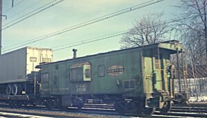 Conrail | Peoria and Eastern / New York Central System | Elizabeth, New Jersey | Class N7c bay window caboose #21498 | January 2, 1977 | H.B. Olsen photograph / collection