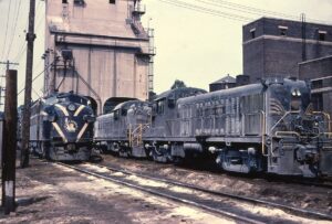 Lehigh and Hudson River Railway | Bethlehem, Pennsylvania | Alco RS 1 and 7 diesel-electric locomotives + CRNJ F3a | near coaling tower | 1965 | Dave Augsburger photograph | Richard Prince collection