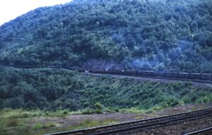 Pennsylvania Railroad | Altoona, Pennsylvania | EMD E8a’s | Westbound Passenger train passing on Horseshoe Curve | August 25, 1966 | Dick Flock photograph / collection