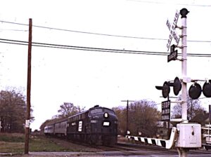 Amtrak | Penn Central Transportation Company | Warwick, Rhode Island | EMD E8a #4262 diesel-electric locomotive | westbound New York bound passenger train | May 10, 1972 | John Wilson photograph / collection