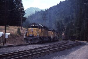 Union Pacific Railroad | Virgilia, California | EMD SD40-2 #3645, #3781 and #3107 diesel-electric locomotives | Feather River Canyon eastbound freight train | August 20, 1983 | Mitchell E, Dakelman photograph / collection