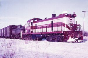 Detroit and Mackinac Railway | Cheboygan, Michigan | Alco RS2 #4610 diesel-electric locomotive | with freight train | 1964 | Richard Wallin photograph | Francis B. Landenberger Palmer Collection