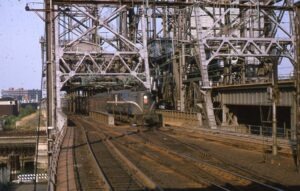 Pennsylvania Railroad | Newark, New Jersey | Altoona Works Class GG1 #4904 electric motor | Westbound Clocker | Passaic River Movable Bridge | November 1964 | Kevin Mugridge photograph / collection