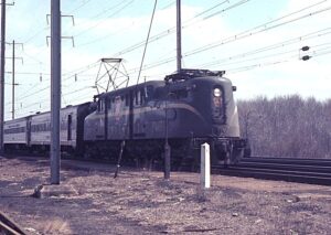 Penn Central Transportation Company | ex-Pennsylvania Railroad | Monmouth Junction, New Jersey | Altoona Works class GG1 #4891 electric motor | eastbound passenger | April 1969 | Ken Kulick photograph / collection