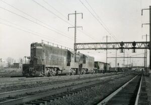 Pennsylvania Railroad | Philadelphia, Pennsylvania | EMD GP7 #8802 + 1 diesel-electric locomotives | near Frankford Junction | January 1958 | Francis B. Landenberger Palmer photograph / collection