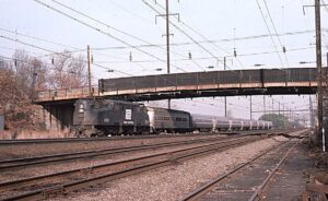 Amtrak | Penn Central Transportation Company | Elizabeth, New Jersey | Altoona Works GG1 #4889 electric motor | Train #169 | December 1975 | Ken Kulick photograph / collection