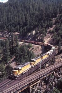 Union Pacific Railroad | Keddie, California | EMD DSD40-2 #3197, #3431 + 1 diesel-electric locomotives | eastbound freight | on Keddie Wye | August 20, 1983 | Mitchell E. Dakelman photograph / collection