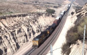 Union Pacific Railroad | Cajon Pass – Summit Scenic Overlook, California | GE AC60CW #7560 + 1 diesel-electric locomotives | Westbound freight | August 16, 2002 | Mitchell E. Dakelman photograph / collection