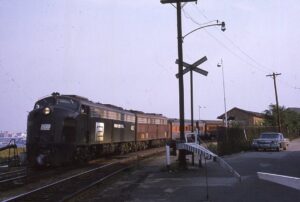 Penn Central Transportation Company | New London, Connecticut | EMD E8a #4257 + 1 diesel-electric locomotives | Eastbound Boston bound passenger train | April 29, 1969 | Allan H. Roberts photograph | Mitchell E. Dakelman collection