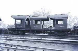Baltimore and Ohio Railroad | Baltimore, Maryland | Flat car #X1601 with cabs from #5065, #678 and #4462 | Monte Clair shops | October 11, 1953 | R.L. Long photograph | West Jersey Chapter, NRHS Collection