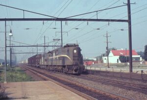 Penn Central Transportation Company | Tullytown, Pennsylvania | Altoona Works GG1 PRR #4872 + 1 PC electric motor | eastbound freight | August 1969 | Ken Kulick photograph / collection