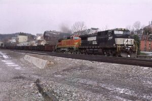 Norfolk Southern Corporation | Jeanette, Pennsylvania | GE D9-40CW #9397 and BNSF C40-CWE8W 843 diesel-electric locomotives | eastbound gondola train | March 15, 2006 | Dick Flock photograph / collection