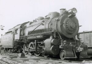 Pennsylvania Railroad | New Castle, Pennsylvania | Baldwin class H10s 2-8-0 #7015 steam locomotive | July 12, 1936 | T.M. Flattley, Jr. photograph | Francis B. Landenberger Palmer collection