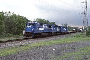 Conrail | Bound Brook, New Jersey | GE C40-8 #6028 and EMD SD40-2 #6489 + #6476 diesel-electric locomotives | Freight PYSE-4 | June 6, 1989 | Dick Flock photograph / collection