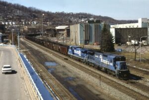 Conrail | Wilmerding, Pennsylvania | GE C40-8 #6035 + 1 electric locomotives | eastbound URT Coal train | March 11, 1985 | Todd Novak photograph | Mitchell E. Dakelman collection