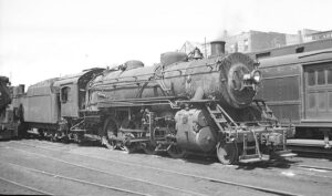 New Haven. New York and Hartford Railroad | New London, Connecticut | USRA 2-8-2 #3021 steam locomotive | 1951 | Milton Paul Baline photograph | Henry Libby collection