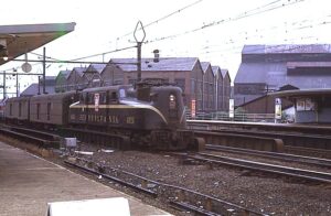 Penn Central Transportation Company | ex Pennsylvania Railroad | Harrison, New Jersey | PATH Station | Altoona Works GG1 #4926 electric motor | eastbound Colonial | August 1968 | Ken Kulick photograph / collection