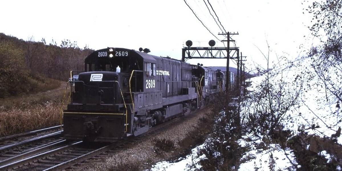 Penn Central Transportation Company | Tunnel Hill, Pennsylvania | aka Gallitzin, Pa. | GE U25B #2609, #2626 + 1 diesel-electric locomotives | westbound freight | October 1972 | Larry Steingarten photograph / collection
