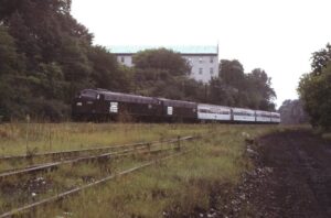 Amtrak | Penn Central Transportation | Peekskill, New York | EMD E8a #272 + 1 diesel-electric locomotives | Train 73 | September 1974 | Ken Kulick photograph / collection