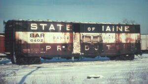 Bangor and Aroostook Railroad | Bangor, Maine | 50 foot, plug door, red-white-blue reefer box car #6402 | February 1974 | Jack de Rossett photograph | Morning Sun Books collection