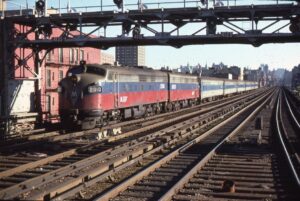 Metro North Commuter Railroad | New York, New York | EMD FL9 #2000 + 1 diesel-electric locomotives | 125th Street | westbound commuter train | July 1986 | Ray Muller photograph | Mitchell E. Dakelman collection
