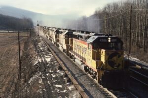 Chessie System | Baltimore and Ohio Railroad | Hyndman, Pennsylvania | EMD GP40-2 #4300 + 6 diesel-electric locomotives | westbound at Hyndman Q Tower | December 30, 1985 | Mitchell E. Dakelman photograph / collection