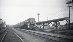 New York, New Haven and Hartford Railroad | Old Saybrook, Connecticut | Class I4 4-6-2 #13xx steam locomotive | Train 15 | Old Saybrook Station & Tower | 1937 | Milton P. Baline photograph | Henry Libby Collectioin