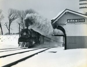 Pennsylvania-Reading Seashore Lines | Pennsylvania Railroad | Kirkwood, New Jersey | Juniata Works class K4s 4-6-2 steam locomotive | Atlantic City bound passenger train | Kirkwood station | March 8, 1953 | R. L. Long photograph | West Jersey Chapter, NRHS Collection