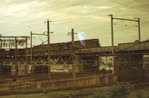 Penn Central Transportation Company | Philadelphia, Pennsylvania | GE Class E44 electric-motors | on elevated bridge structure | westbound freight service | August 1969 | Ken Kulick photograph / collection