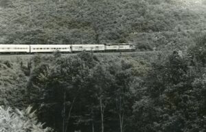 Amtrak | on Penn Central Transportation | Altoona, Pennsylvania | EMD SDP40F diesel-electric locomotive | Horseshoe Curve | eastbound National Limited | August 1974 | Ed Kaspriske photograph / collection