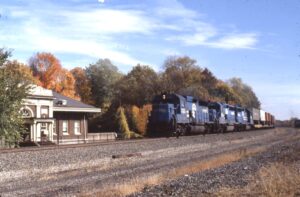 Conrail | Sewickley, Pennsylvania | EMD GP40-2 #3328 and #3350 diesel-electric locomotives | westbound TV train passing former Station | nice fall color | October 22, 1988 | Dick Flock photograph / collection
