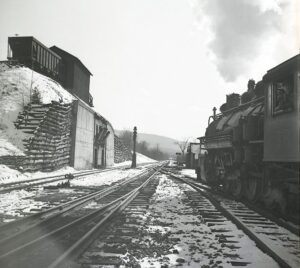 East Broad Top Railroad | Rockhill Furnace, Pennsylvania | Baldwin Class 2-8-2 narrow gauge steam locomotive | Coaling dock station with coal hopper on top | looking south | February 1954 | Fielding Lew Bowman photograph / collection