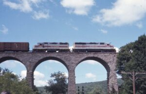 Erie Lackawanna Railway | Lanesboro, Pennsylvania | EMD SD45 #803 and GP35 #2586 diesel-electric locomotives | Crossing D&H over Erie Starrucca Viaduct | EB Sante Fe 100 | Charles “Sandy” Burton photograph | Jersey Central Chapter, NRHS Collection