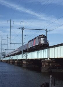New Jersey Transit | South Amboy, New Jersey | EMD GP40PH-2B #4149 diesel-electric locomotive | westbound Bay Head, NJ bound passenger train | Raritan Bay Bridge | June 2, 1995 | Mitchell E. Dakelman photograph / collection