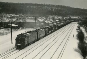 Pennsylvania Railroad | Lilly, Pennsylvania | EMD F7a #9557, #9808, Alco RS3 #8590, #8595 and #8591 diesel-electric locomotives | Westbound West Brownsville Coal Train extra | December 19,1960 | Fred Kern, Jr.  photograph | Francis B. Landenberger Palmer collection
